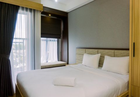 Kamar Tidur Warm and Minimalist Studio at Transpark Bintaro Apartment By Travelio