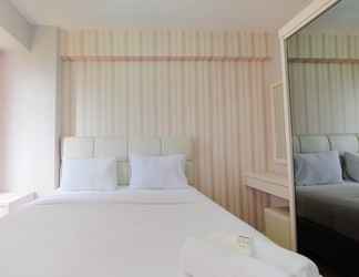 Bedroom 2 Comfort 2BR at 26th Floor Bassura City Apartment By Travelio