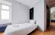 Bedroom 2 Simply Look and Comfort 2BR at Great Western Apartment By Travelio