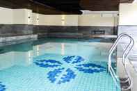 Swimming Pool Luxury 2BR at Tamansari La Grande Apartment By Travelio