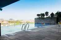 Swimming Pool Modern Studio Apartment (No Kitchen) at Tamansari Papilio By Travelio