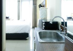Common Space 5 Modern Studio Apartment (No Kitchen) at Tamansari Papilio By Travelio