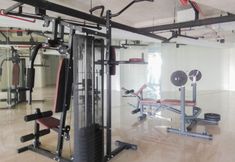 Fitness Center 7 Well Design and Simply Studio at Patraland Urbano Apartment By Travelio