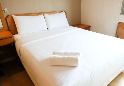 Bedroom Homey and Extra Spacious 2BR at Kondominium Puncak Marina Apartment By Travelio
