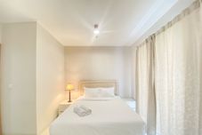 Bedroom Comfort and Elegant 2BR Apartment at The Mansion Kemayoran By Travelio
