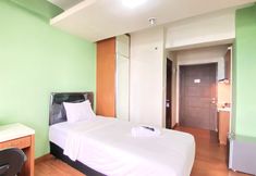 Bedroom 2 Minimalist Studio Apartment at Oxford Jatinangor By Travelio