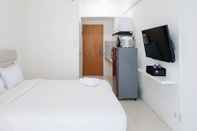 Kamar Tidur Comfy and Homey Studio at Puncak Bukit Golf Surabaya Apartment By Travelio