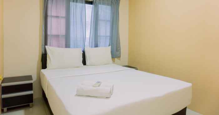 Kamar Tidur Homey and Minimalist 1BR at Puri Garden Apartment By Travelio