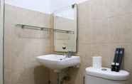 In-room Bathroom 5 Tidy and Cozy Living 2BR Green Bay Pluit Apartment By Travelio