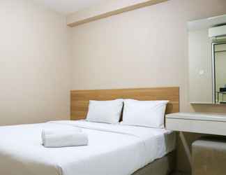 Bedroom 2 Tidy and Cozy Living 2BR Green Bay Pluit Apartment By Travelio