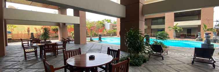 Lobby Homey and Comfort 3BR at Pesona Bahari Apartment By Travelio