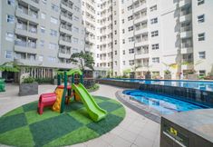 Swimming Pool 7 Nice and Fancy 2BR Apartment at Parahyangan Residence By Travelio