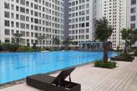 Swimming Pool Homey Designed and Spacious 3BR Apartment at M-Town Residence By Travelio