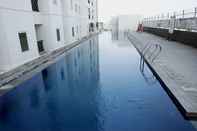 Swimming Pool Minimalist and Warm 2BR at Northland Ancol Apartment By Travelio