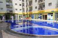 Swimming Pool Simply and Homey 2BR at Suites @Metro Apartment By Travelio
