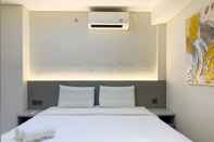 Bedroom Enjoy Living and Comfort 2BR at Daan Mogot City Apartment By Travelio