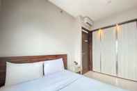 Kamar Tidur Cozy and Chic 2BR at Mekarwangi Square Cibaduyut Apartment By Travelio