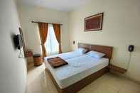 Bedroom Adiputra Guesthouse 3