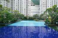 Swimming Pool Modern and Large 2BR Apartment at Green Bay Pluit Facing Spectacular Sea View By Travelio