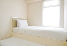 Bedroom 2 Modern and Large 2BR Apartment at Green Bay Pluit Facing Spectacular Sea View By Travelio