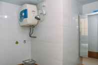 In-room Bathroom Comfortable and Strategic 2BR Apartment at Green Pramuka City By Travelio