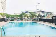 Swimming Pool Homey and Comfort Studio Apartment at Tifolia By Travelio