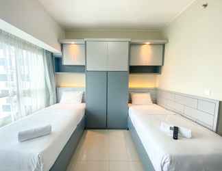 Bedroom 2 Restful Studio Room at Springlake Summarecon Apartment near Mall By Travelio