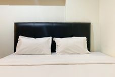 Bedroom Warm and Homey 1BR Apartment at Belmont Residence Puri By Travelio