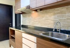 Common Space 4 Warm and Homey 1BR Apartment at Belmont Residence Puri By Travelio