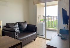 Common Space 2 Warm and Homey 1BR Apartment at Belmont Residence Puri By Travelio