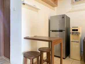 Common Space 4 Warm and Homey 1BR Apartment at Belmont Residence Puri By Travelio