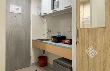 Ruang Umum 2 Cozy Studio Apartment at Osaka Riverview PIK 2 By Travelio