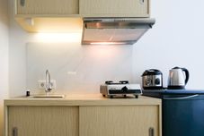 Common Space Good Studio Apartment Connected to Mall at Orchard Supermall Mansion By Travelio