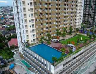 Bangunan 2 Good Deal and Comfy 1BR Apartment at Vida View By Travelio