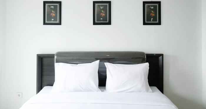 Kamar Tidur Comfy and Modern Studio (No Kitchen) Apartment at Orchard Supermall Mansion By Travelio