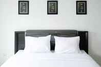 Kamar Tidur Comfy and Modern Studio (No Kitchen) Apartment at Orchard Supermall Mansion By Travelio