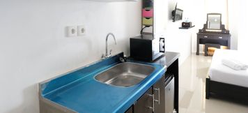 Common Space 2 Comfy and Modern Studio (No Kitchen) Apartment at Orchard Supermall Mansion By Travelio