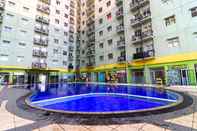 Swimming Pool Modest 2BR at Suites @Metro Apartment By Travelio