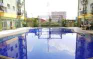 Swimming Pool 7 Modest 2BR at Suites @Metro Apartment By Travelio