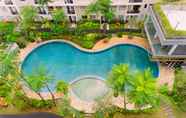 Swimming Pool 6 Warm and Minimalist 1BR at Scientia Residence Apartment By Travelio