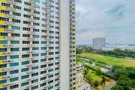 Bangunan Modern and Homey 2BR Apartment at Springlake Summarecon Bekasi By Travelio