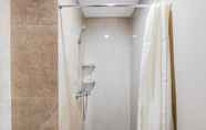 In-room Bathroom 3 Cozy Living Studio Apartment at Transpark Bintaro By Travelio