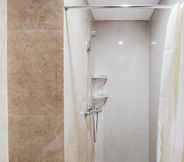 In-room Bathroom 3 Cozy Living Studio Apartment at Transpark Bintaro By Travelio