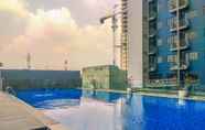 Swimming Pool 6 Combined 3BR without Living Room at Evenciio Margonda Apartment By Travelio