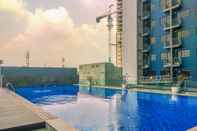 Swimming Pool Combined 3BR without Living Room at Evenciio Margonda Apartment By Travelio
