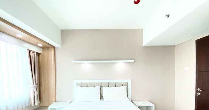 Bedroom Cozy 1BR Apartment at Tamansari La Grande By Travelio