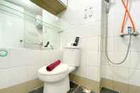 In-room Bathroom Cozy and Comfy Studio Apartment at Bassura City By Travelio