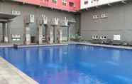 Swimming Pool 7 Nice and Elegant 2BR Apartment at Green Pramuka City By Travelio