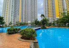 Swimming Pool 6 Best Homey and Nice 2BR Apartment at Springalake Summarecon Bekasi By Travelio