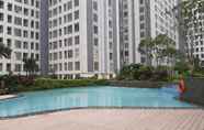 Swimming Pool 6 Fancy and Simply 1BR at M-Town Residence Apartment By Travelio